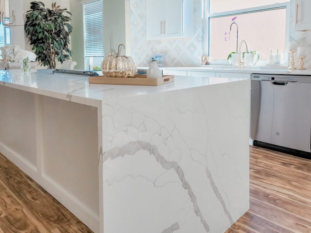 Modern Bronze and White Kitchen with Waterfall Island by Carr Cabinets (11)